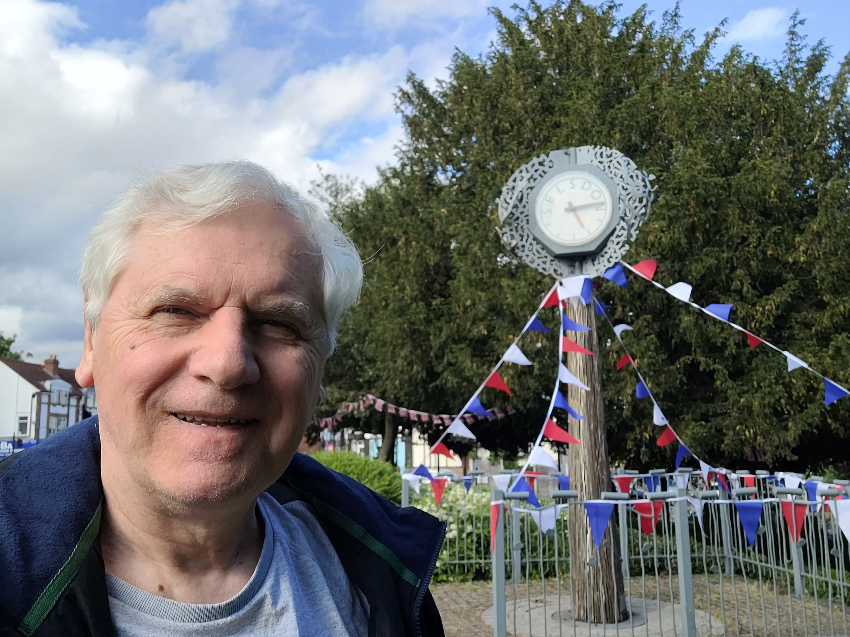 Picture of Robert Ward in front of Selsdon clock, now working