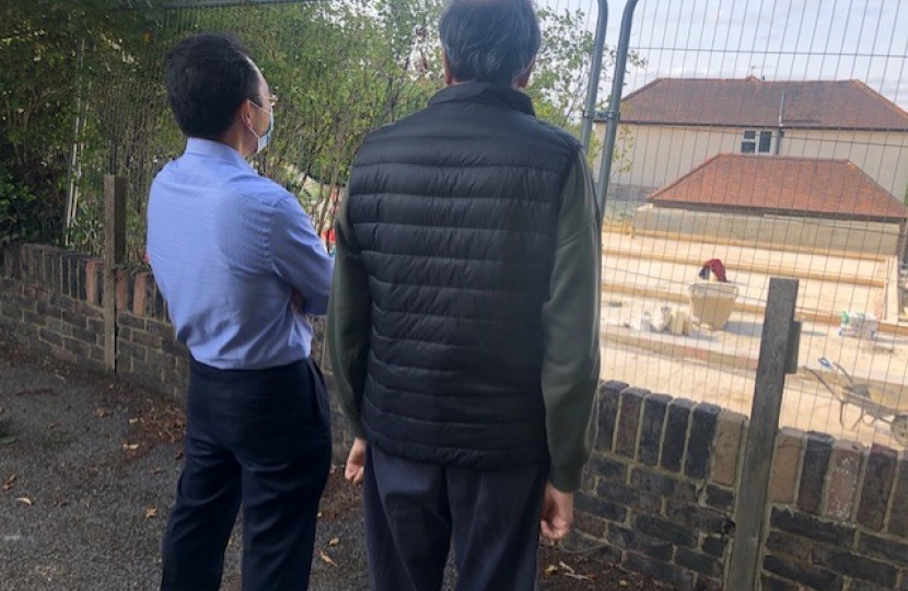 Residents looking at the concrete plinth built at 22 Briton Crescent