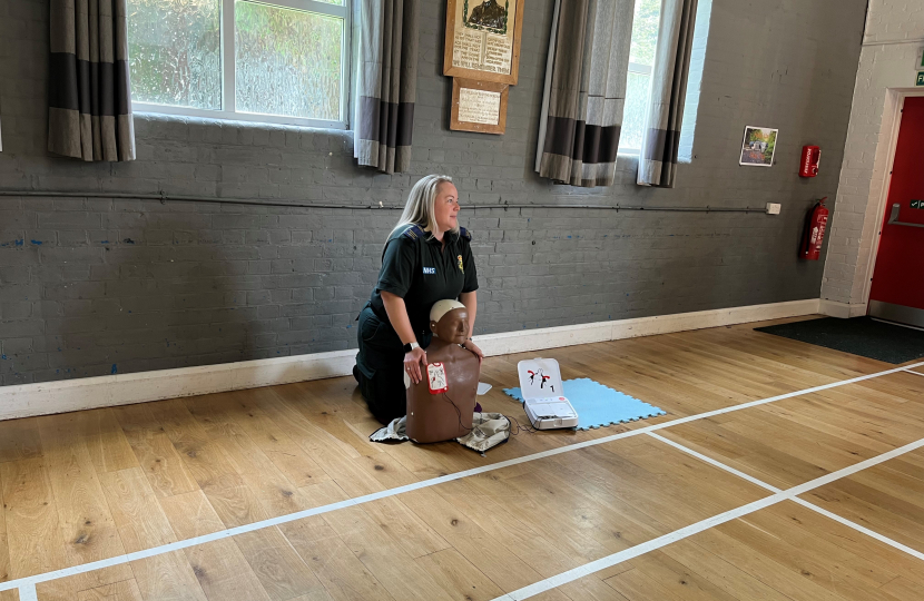 London paramedic showing how to give CPR