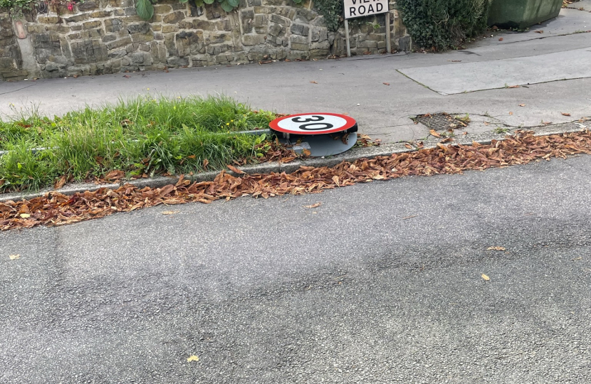 Traffic sign on grass verge in Hurst View road