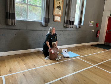 London paramedic showing how to give CPR